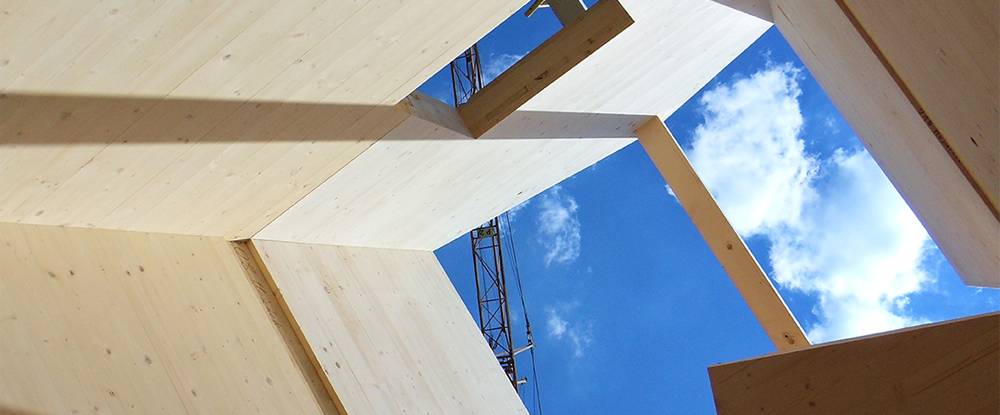 Two students stand in Common Ground High School in New Haven, CT, which was built with cross-laminated timber